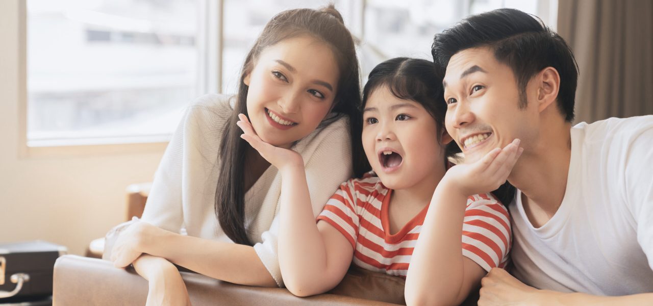 Happy Attractive Young asian Family Portrait Healthy harmony in life family day concept asian family man woman and little girl having good time together.